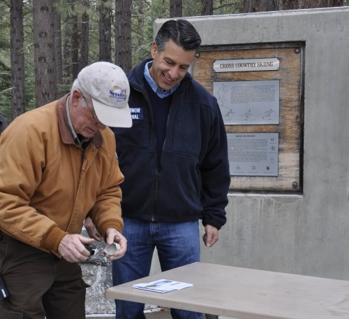 Nevada Governor Brian Sandoval getting his Nevada State Parks Passport stamped at Sand Harbor, Lake Tahoe