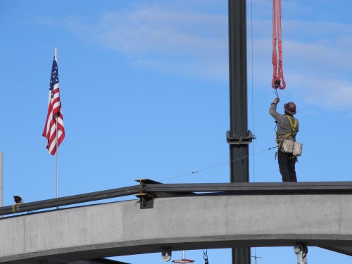 Virginia Street Bridge worker atop one of the new arches, Reno, Nevada
