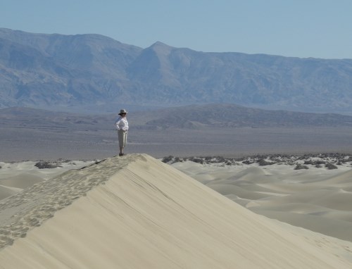 Death Valley National Park, hiker on sand dunes